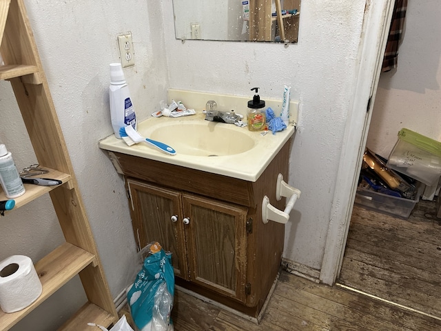 bathroom featuring vanity and wood-type flooring