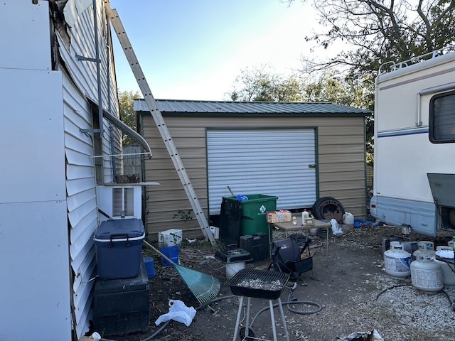 exterior space featuring an outbuilding and a garage