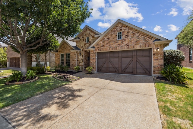 front of property featuring a front lawn and a garage