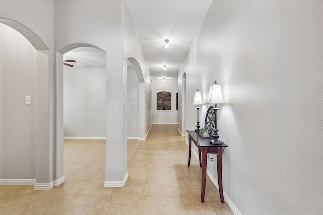 corridor featuring light tile patterned floors