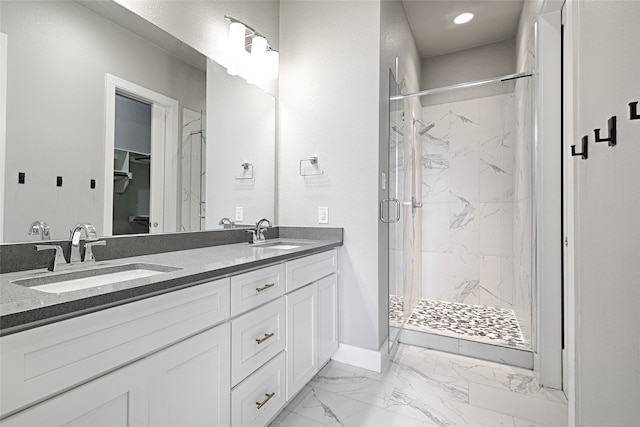 bathroom featuring vanity and an enclosed shower