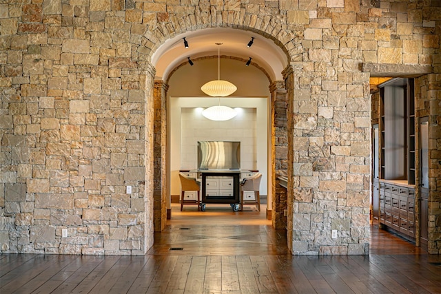 corridor with dark hardwood / wood-style floors