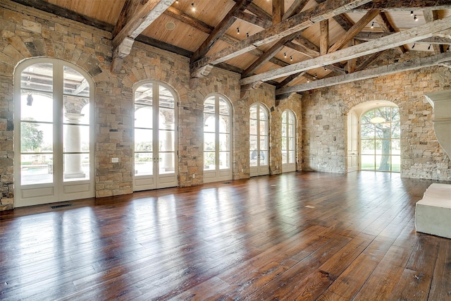 unfurnished room featuring wooden ceiling, high vaulted ceiling, hardwood / wood-style flooring, and a healthy amount of sunlight