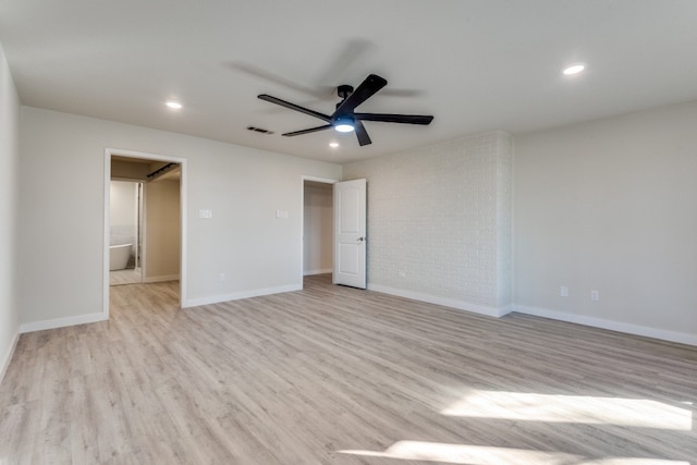 unfurnished bedroom with ensuite bath, ceiling fan, and light wood-type flooring