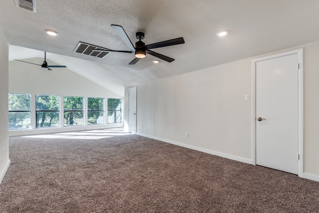 unfurnished room with carpet, ceiling fan, lofted ceiling, and a textured ceiling