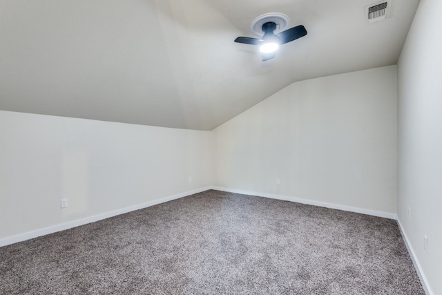 additional living space with carpet flooring, ceiling fan, and lofted ceiling