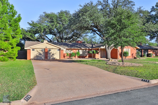 ranch-style home with a garage and a front yard