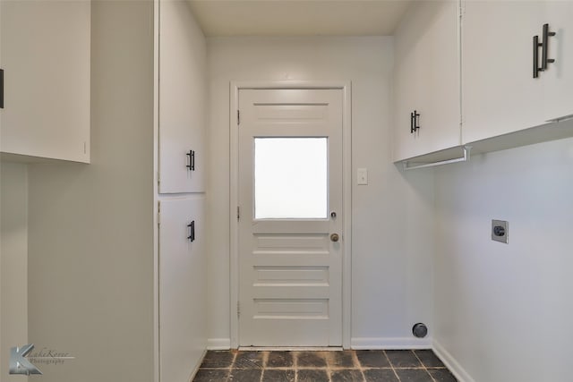 laundry area featuring cabinets and hookup for an electric dryer