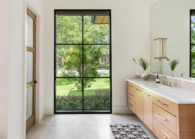 bathroom with tile patterned floors and vanity