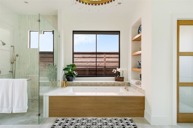 bathroom with separate shower and tub and tile patterned floors