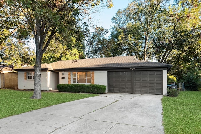 ranch-style home with a front yard and a garage