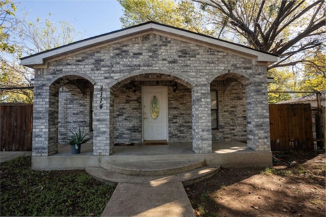 1114 Alexander St, Irving, TX 75061 - view of front facade with a porch and brick siding
