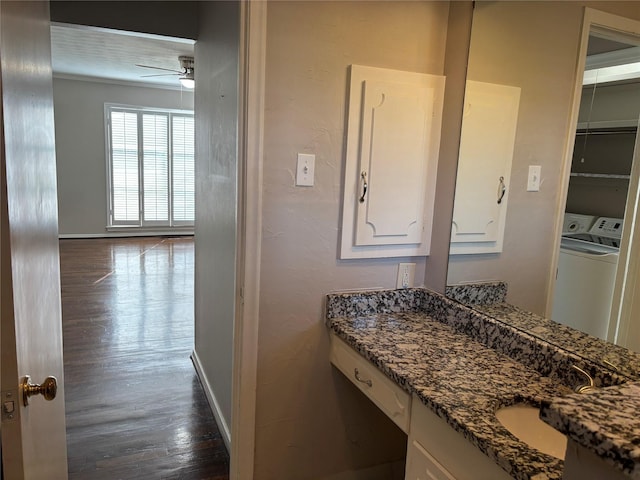 bathroom featuring vanity, hardwood / wood-style flooring, and ceiling fan