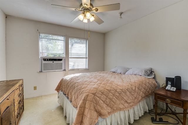 bedroom with ceiling fan, cooling unit, and light colored carpet