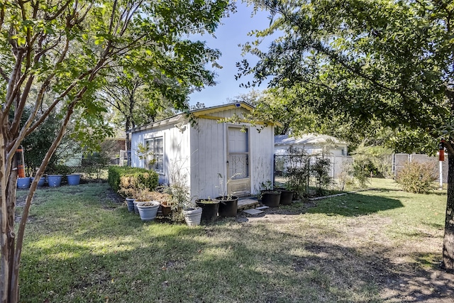 view of outdoor structure with a lawn