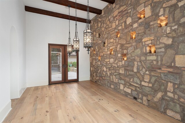 kitchen featuring tasteful backsplash, wood ceiling, light wood-style flooring, cream cabinets, and a sink