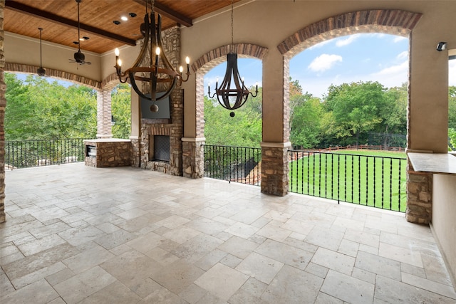 view of patio with an outdoor fireplace