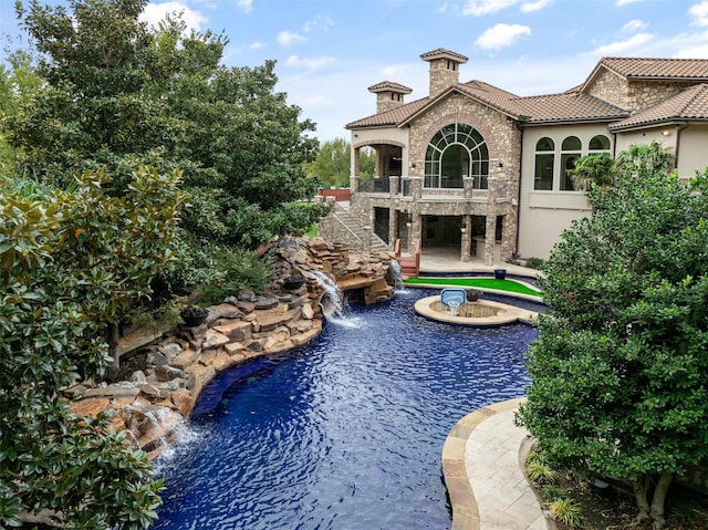 view of pool featuring a patio area and stairs