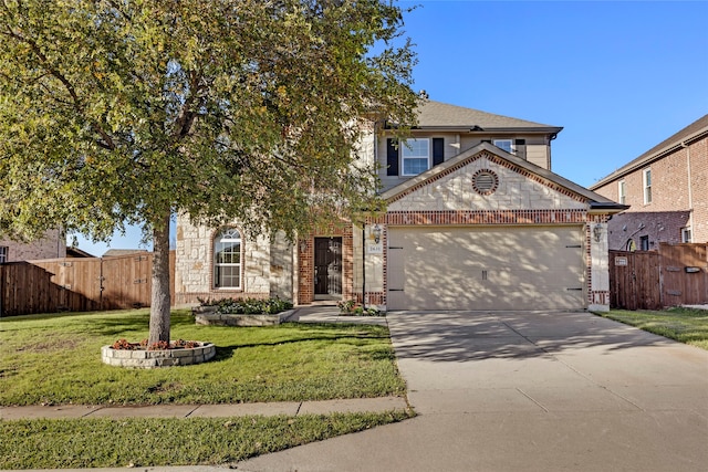 view of front of home with a garage and a front yard