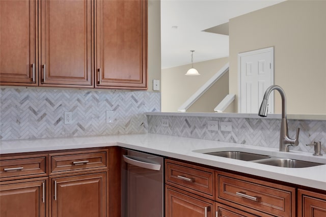 kitchen featuring sink, decorative backsplash, and decorative light fixtures