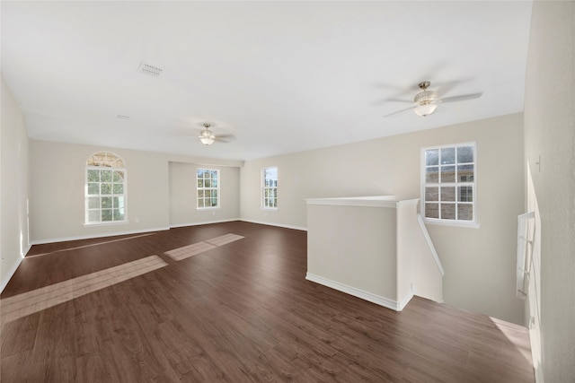 unfurnished room with dark hardwood / wood-style floors and ceiling fan