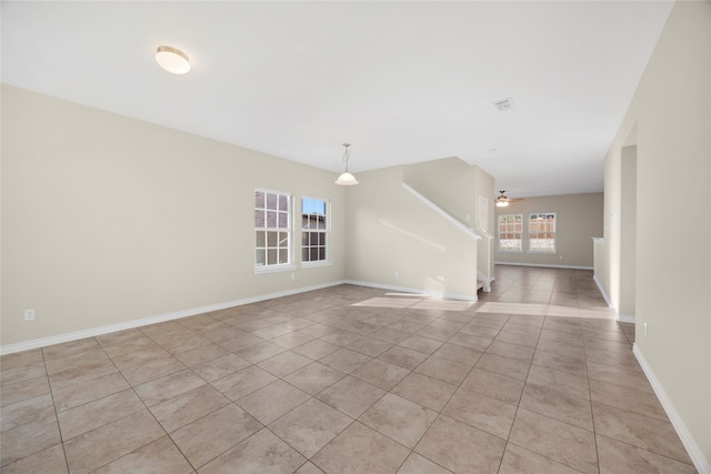 unfurnished room featuring ceiling fan