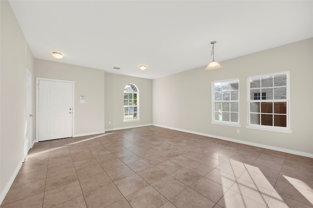 spare room with light tile patterned floors