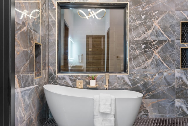 bathroom featuring a tub and tile walls