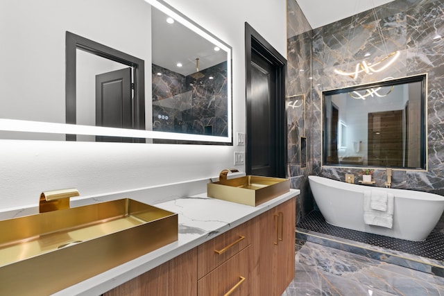 bathroom featuring vanity, tile walls, and independent shower and bath