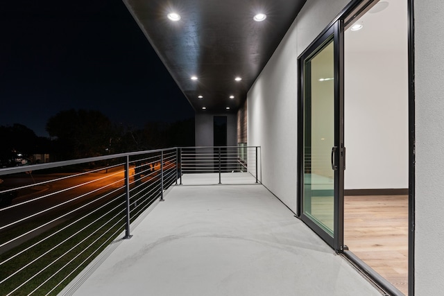 view of balcony at twilight