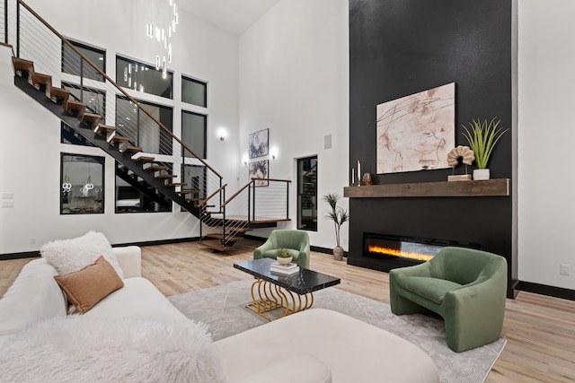 living room featuring hardwood / wood-style floors and a high ceiling