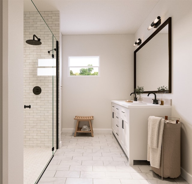 bathroom with tile patterned flooring, a tile shower, and vanity