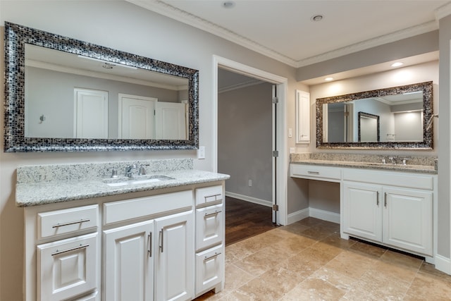 bathroom featuring crown molding, vanity, and wood-type flooring