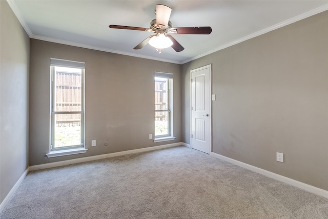 unfurnished room with light carpet, crown molding, and a healthy amount of sunlight