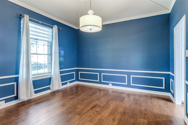 spare room with wood-type flooring and crown molding