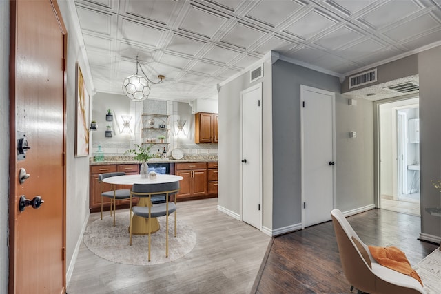 kitchen with hardwood / wood-style floors and tasteful backsplash