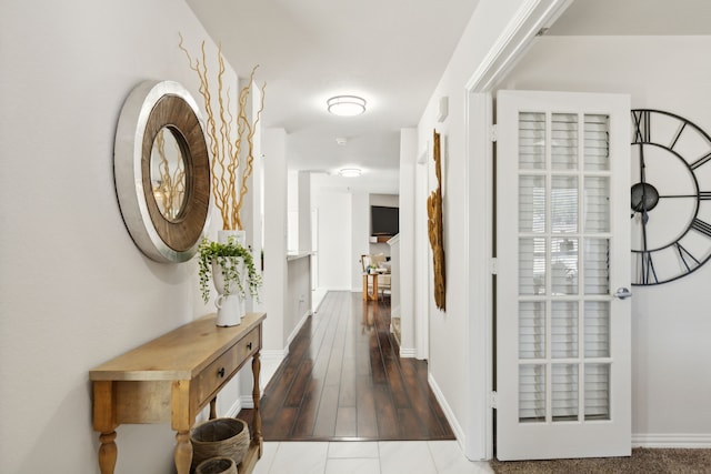 corridor with wood-type flooring