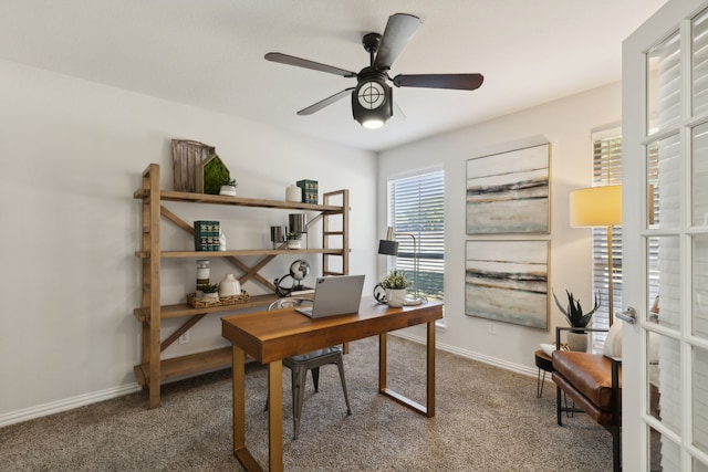 office space featuring ceiling fan and carpet