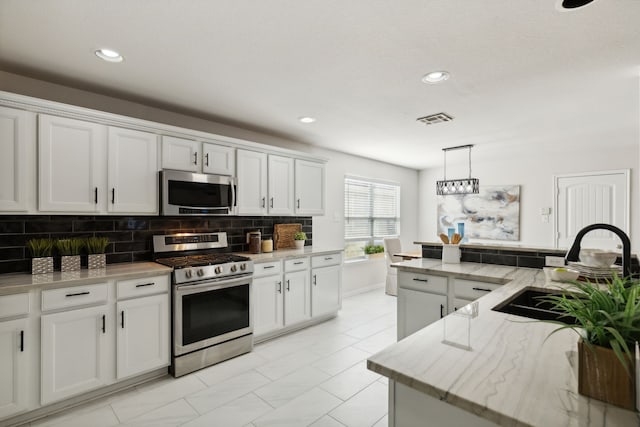 kitchen with white cabinets and stainless steel appliances