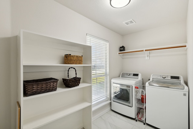 washroom featuring washer and dryer