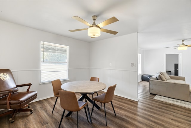 dining room featuring dark hardwood / wood-style floors and ceiling fan