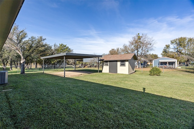 view of yard featuring a shed, a carport, and cooling unit