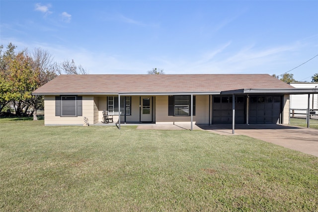 ranch-style home featuring covered porch, a carport, and a front yard