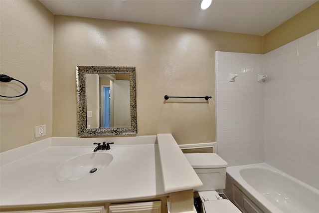 full bathroom with washtub / shower combination, vanity, and toilet