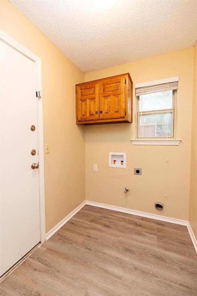 unfurnished bedroom with ceiling fan, carpet, and a textured ceiling