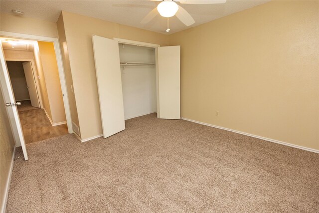 unfurnished room with vaulted ceiling with beams, ceiling fan, light wood-type flooring, and a textured ceiling