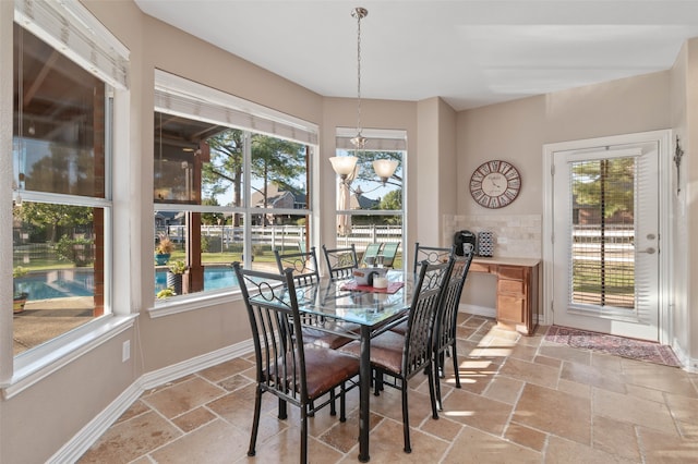 dining space featuring a notable chandelier