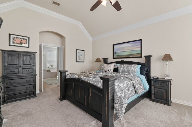 bedroom with light carpet, vaulted ceiling, ceiling fan, and crown molding