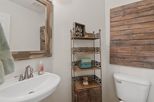 bathroom with toilet and sink