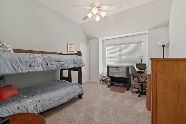 carpeted bedroom featuring ceiling fan and vaulted ceiling